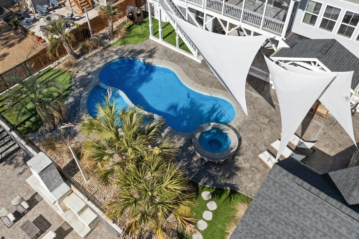 Aerial view of a palm-lined residential pool and spa - Punta Gorda, FL pool resurfacing service area