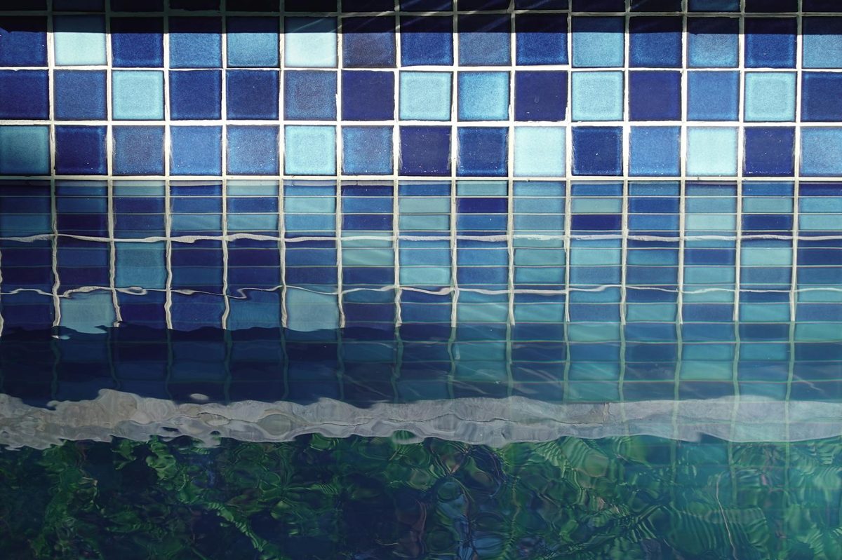 Blue mosaic waterline tile in a swimming pool - pool tile installation in Cape Coral, FL