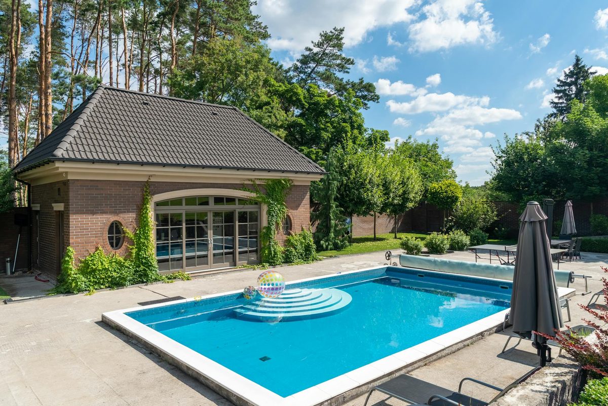 Residential backyard pool with a bright blue finish - quartz pool finish in Cape Coral, FL